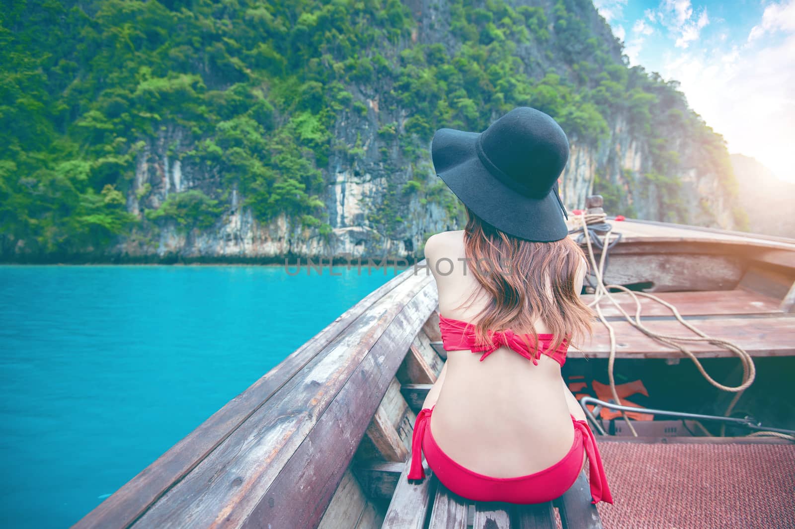 Beautiful girl in red bikini on boat. by gutarphotoghaphy