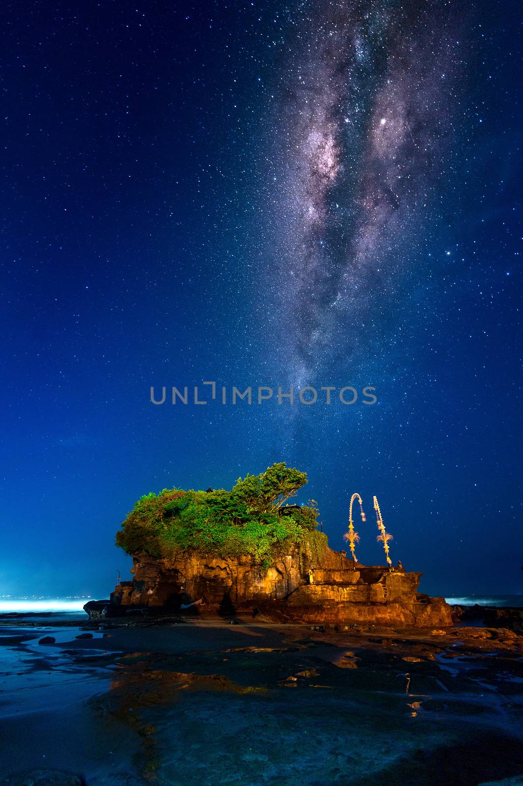Milky way over Tanah Lot Temple at night in Bali, Indonesia.(Dark) by gutarphotoghaphy