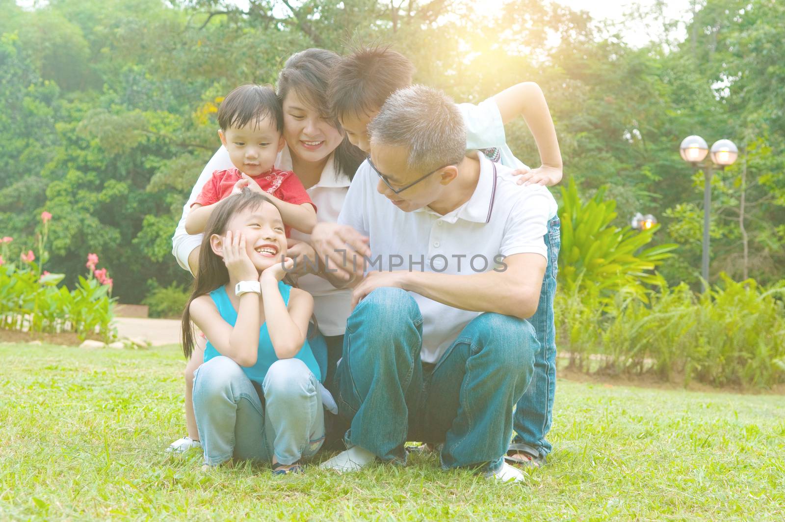 asian family having fun time at outdoor