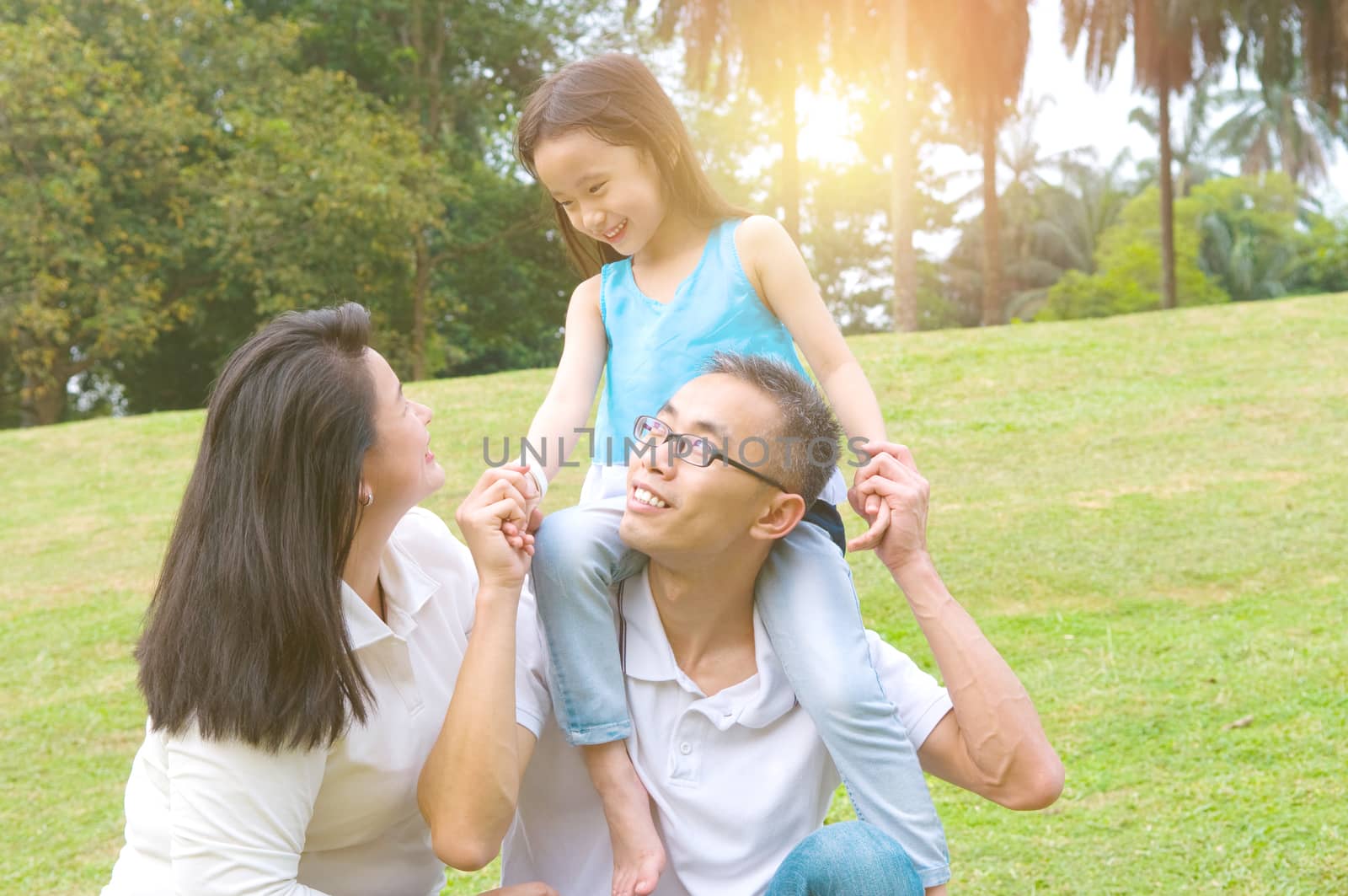 Asian family having fun in the park