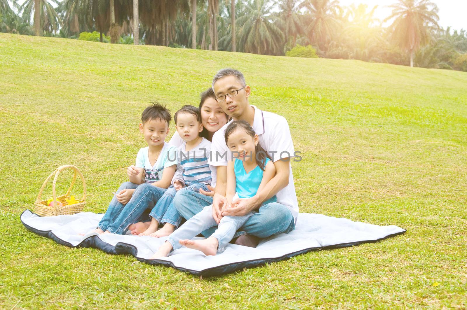 Outdoor portrait of asian family