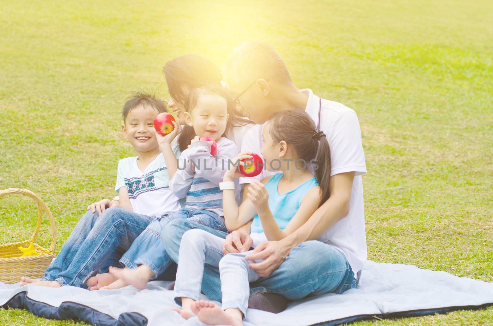 asian family having fun time at outdoor