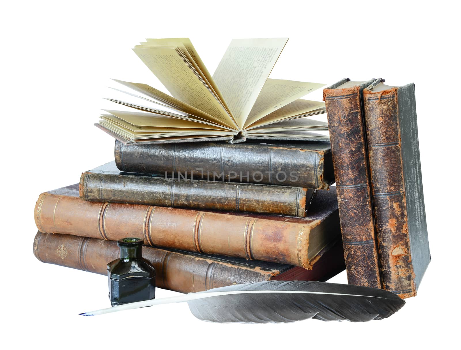 Stack of the old books, quill and the inkwell isolated on a white background