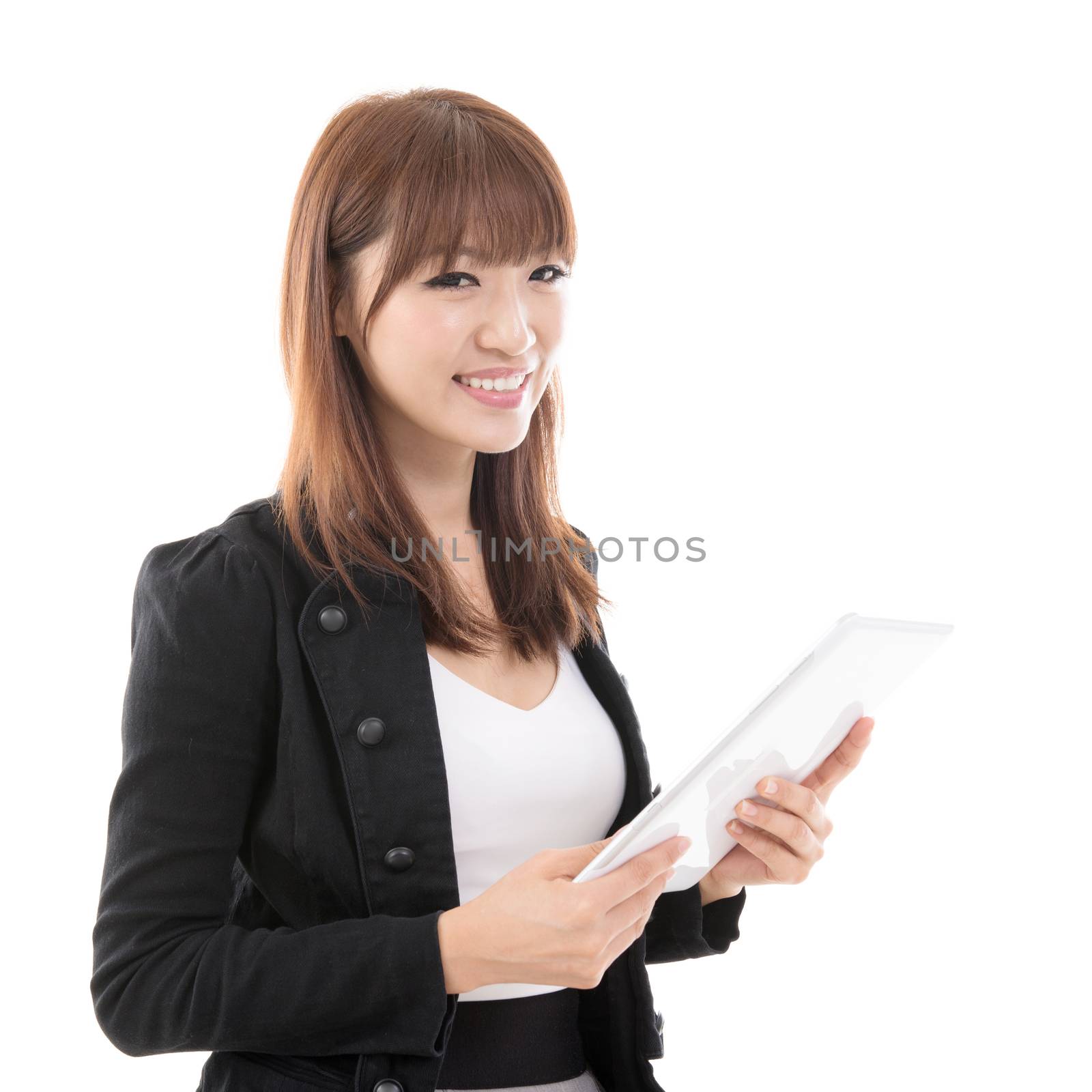 Young Asian girl using digital computer pad, isolated on white background.