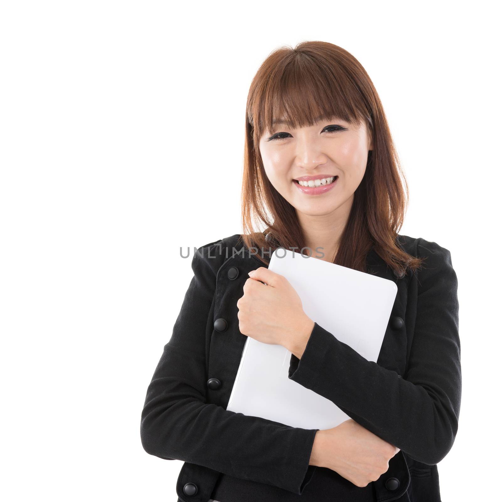 Young Asian woman holding digital computer tablet and smiling, isolated on white background.