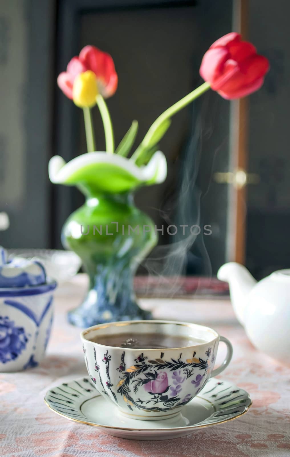 the morning Cup of tea on the table on blurred background