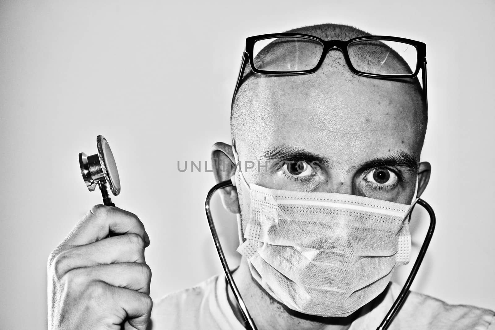 Young man doctor with a stetoscope in hand