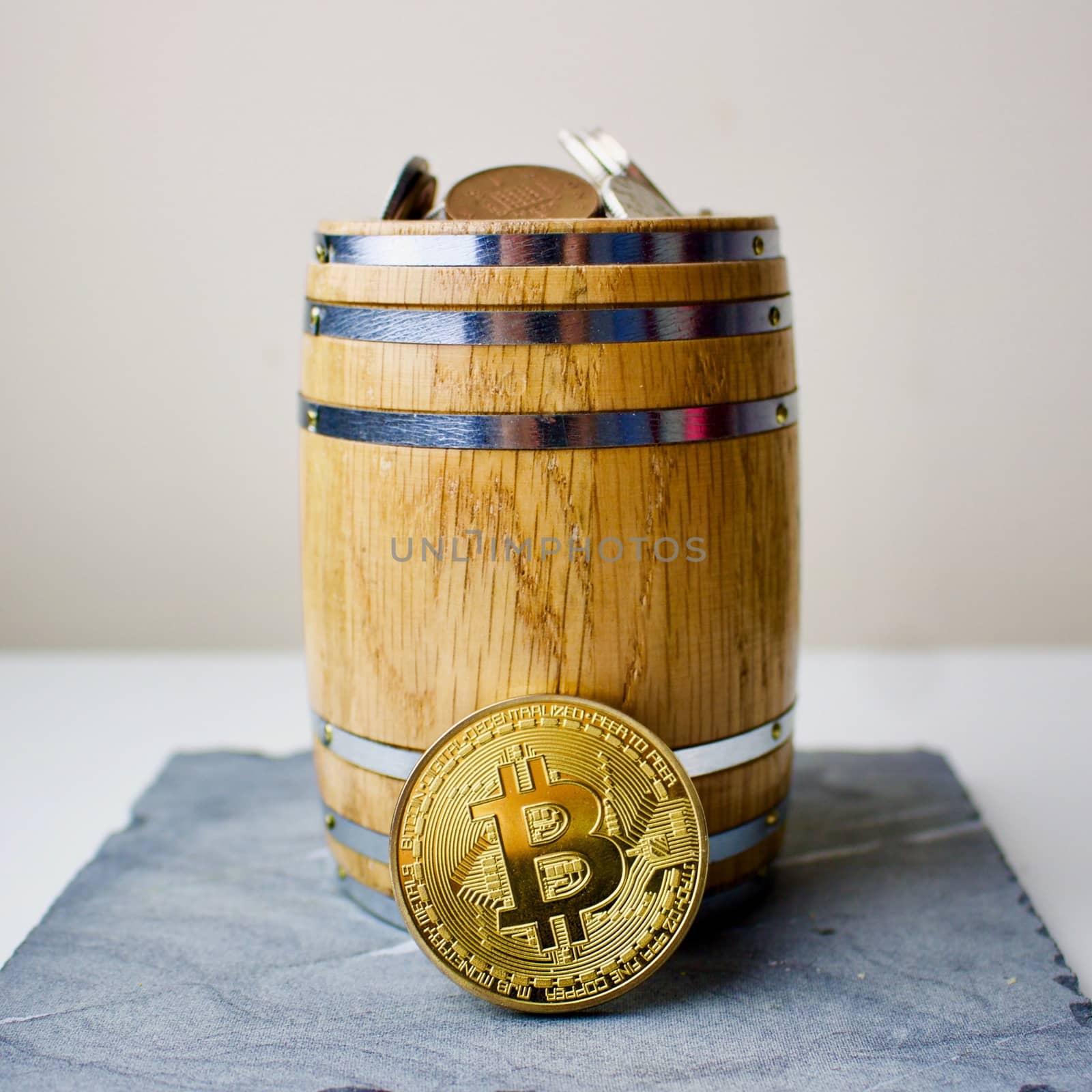 Gold bitcoin in barrel