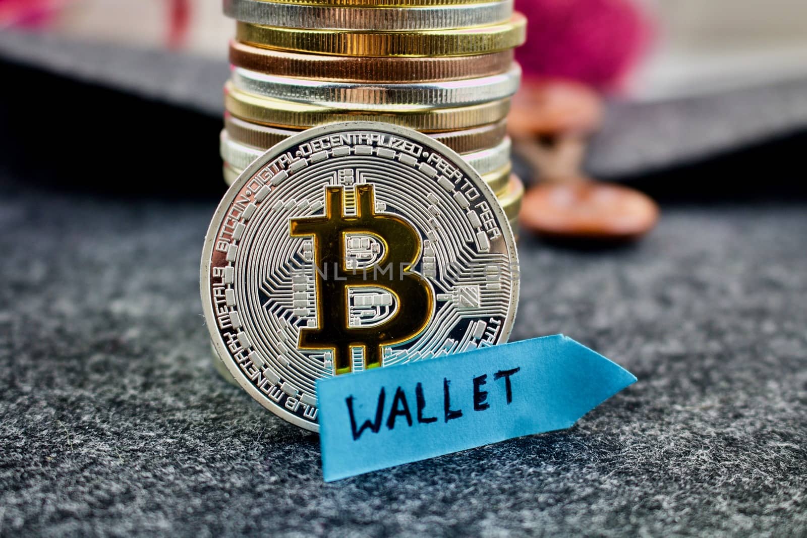 Digital currency physical silver bitcoin coin and blue sign wallet