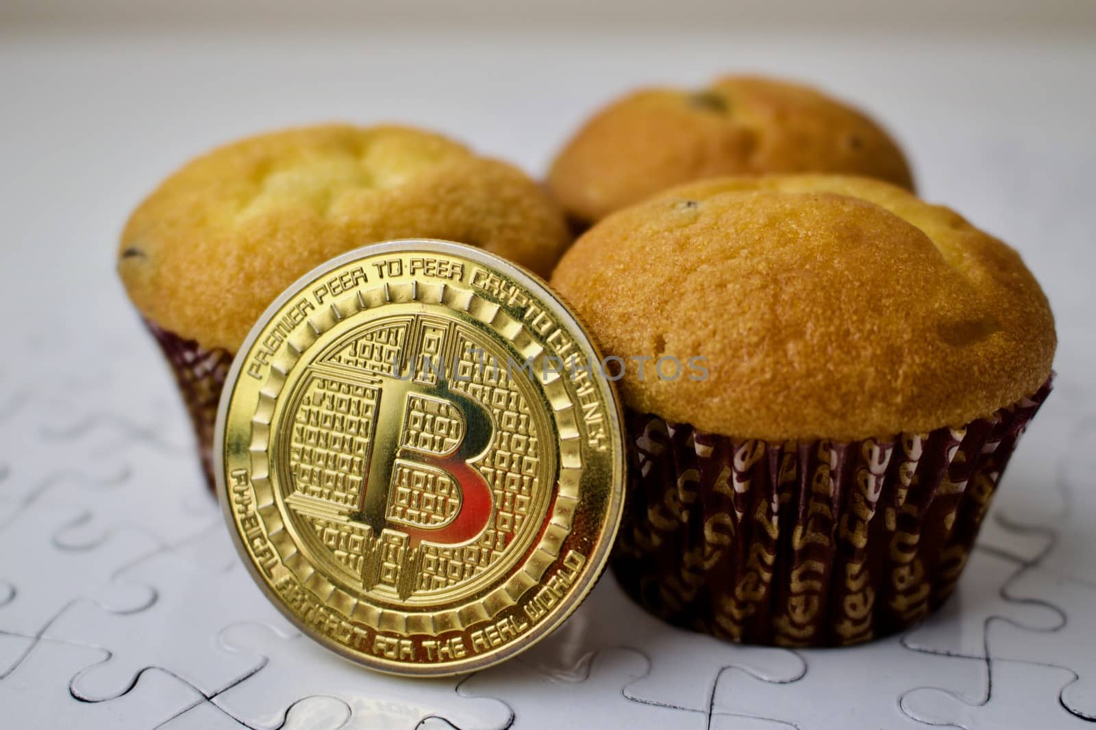 Bitcoin cryptocurrency with sweet cupcakes