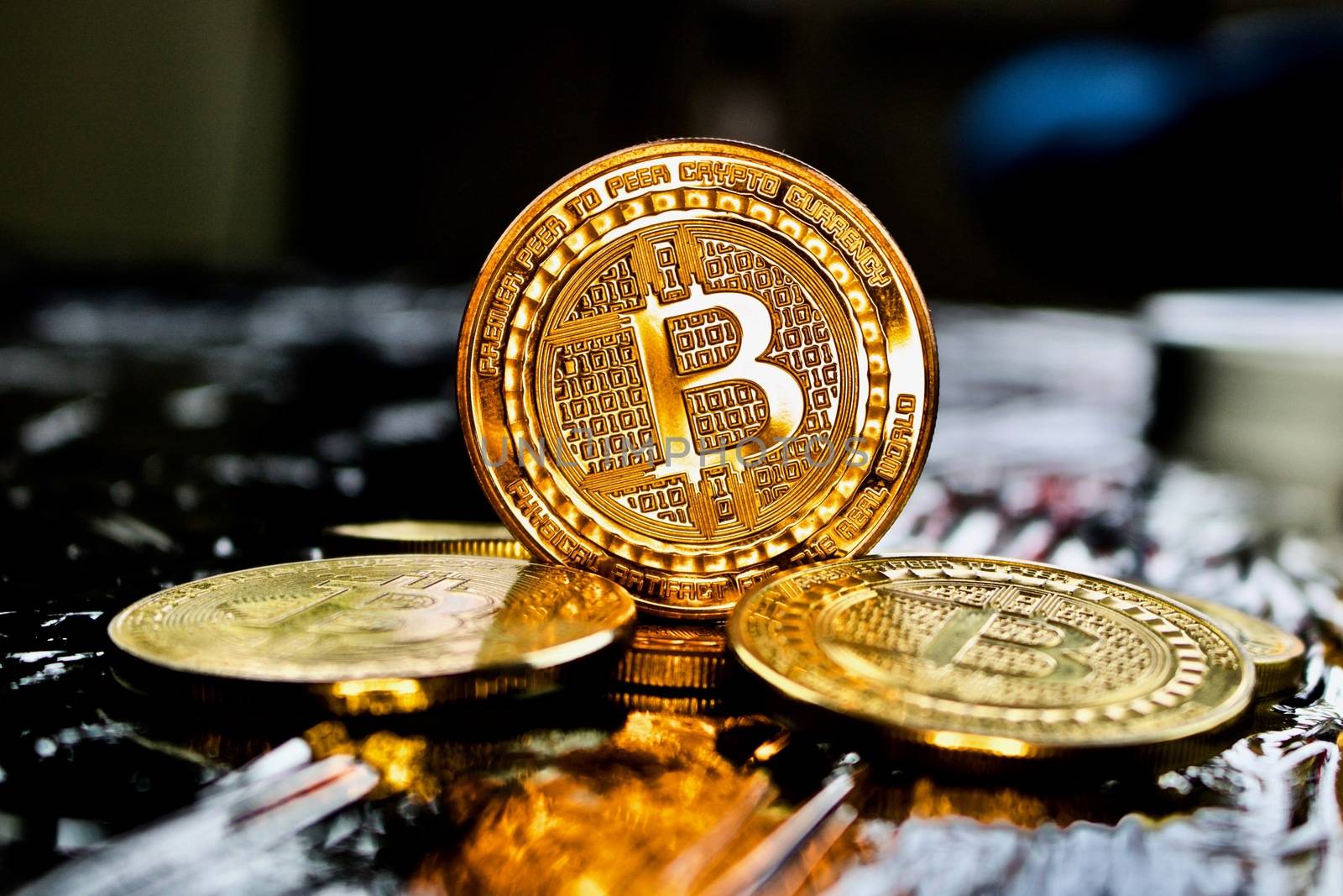Cryptocurrency physical gold bitcoin coin near bitcoins