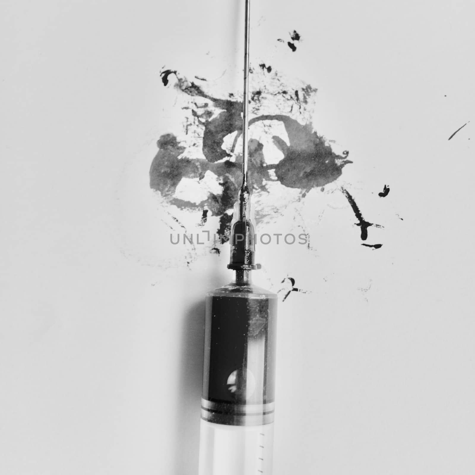Syringe with needle. Black & white art concept.