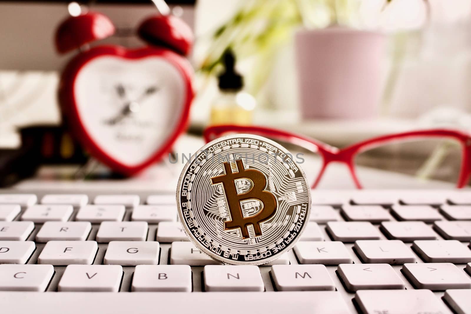 Cryptocurrency silver bitcoin coin with red clock