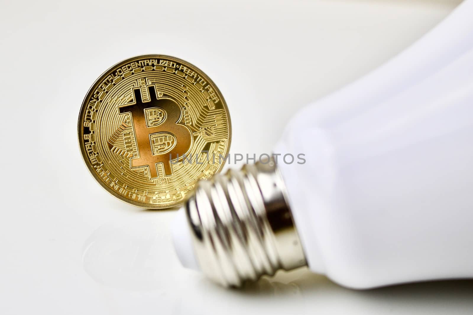 Physical bitcoin coin and bulb