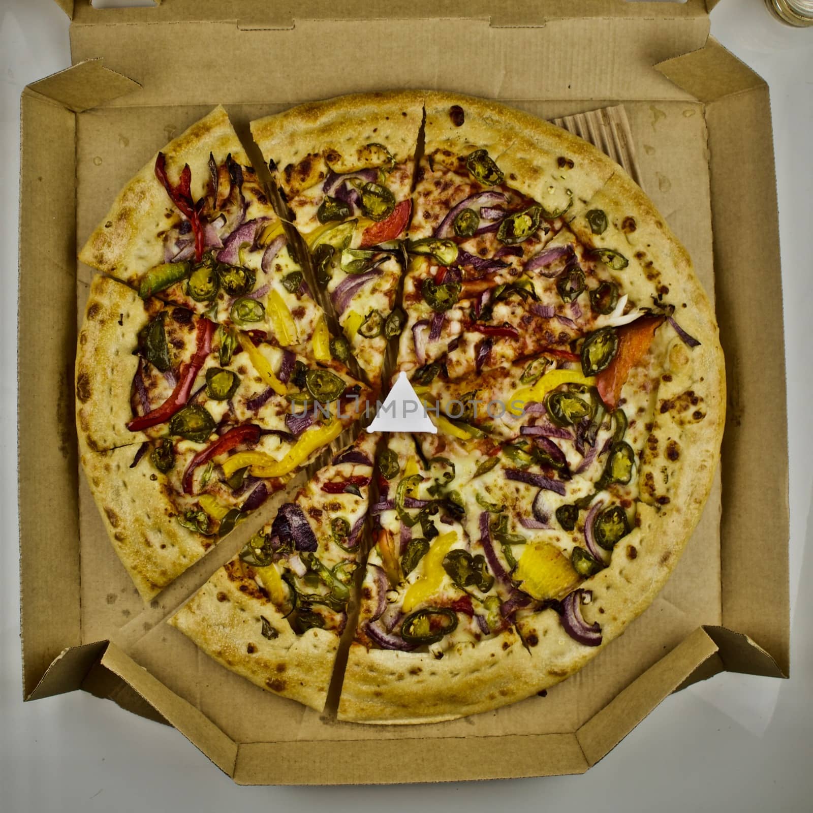 Big fresh vegetarian pizza in delivery box
