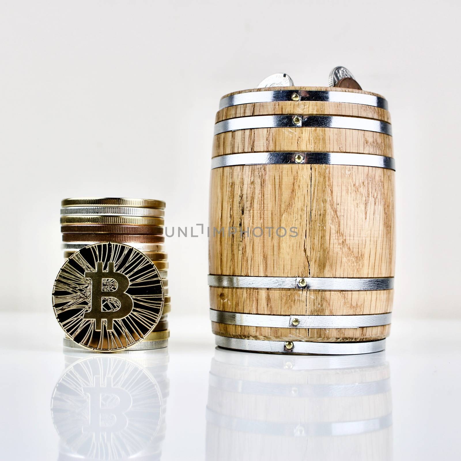 Gold bitcoin coin and wooden barrel