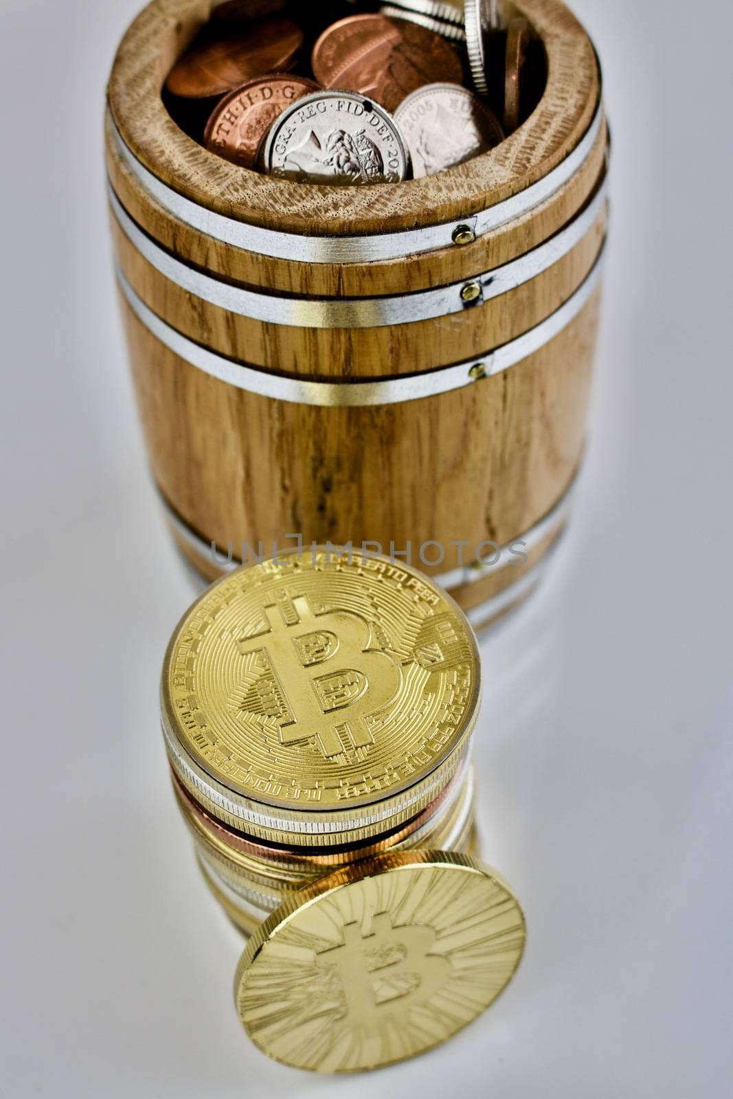 Wooden barrel with money and bitcoin physical coin