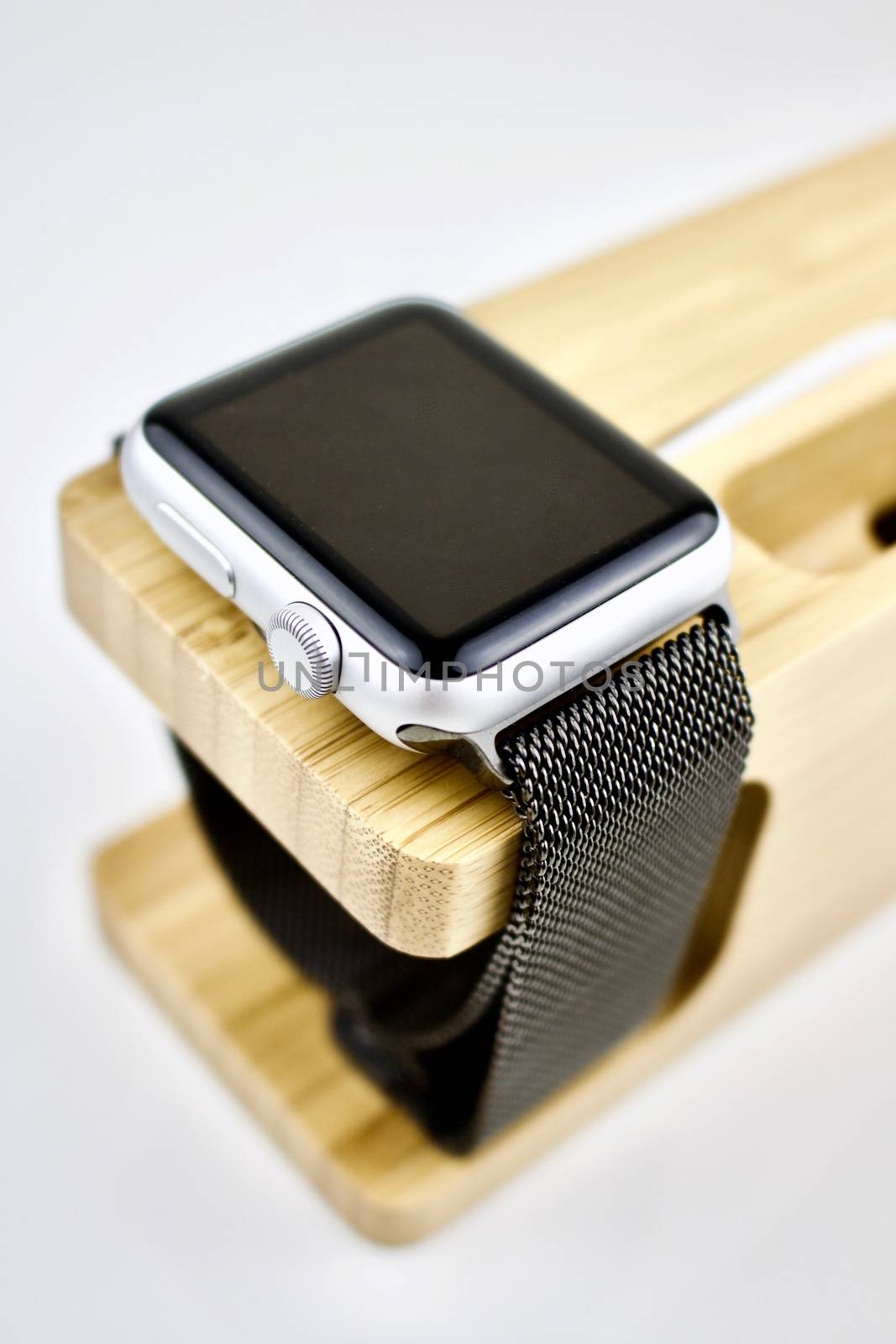 Black smartwatch on charger