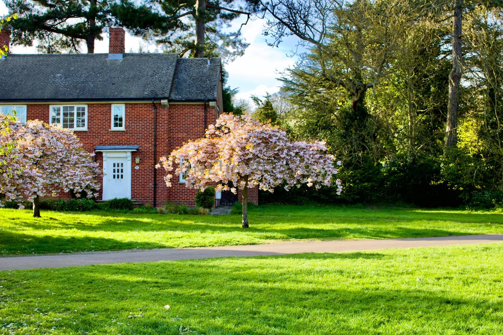 Old brick house in public park. Bedford.