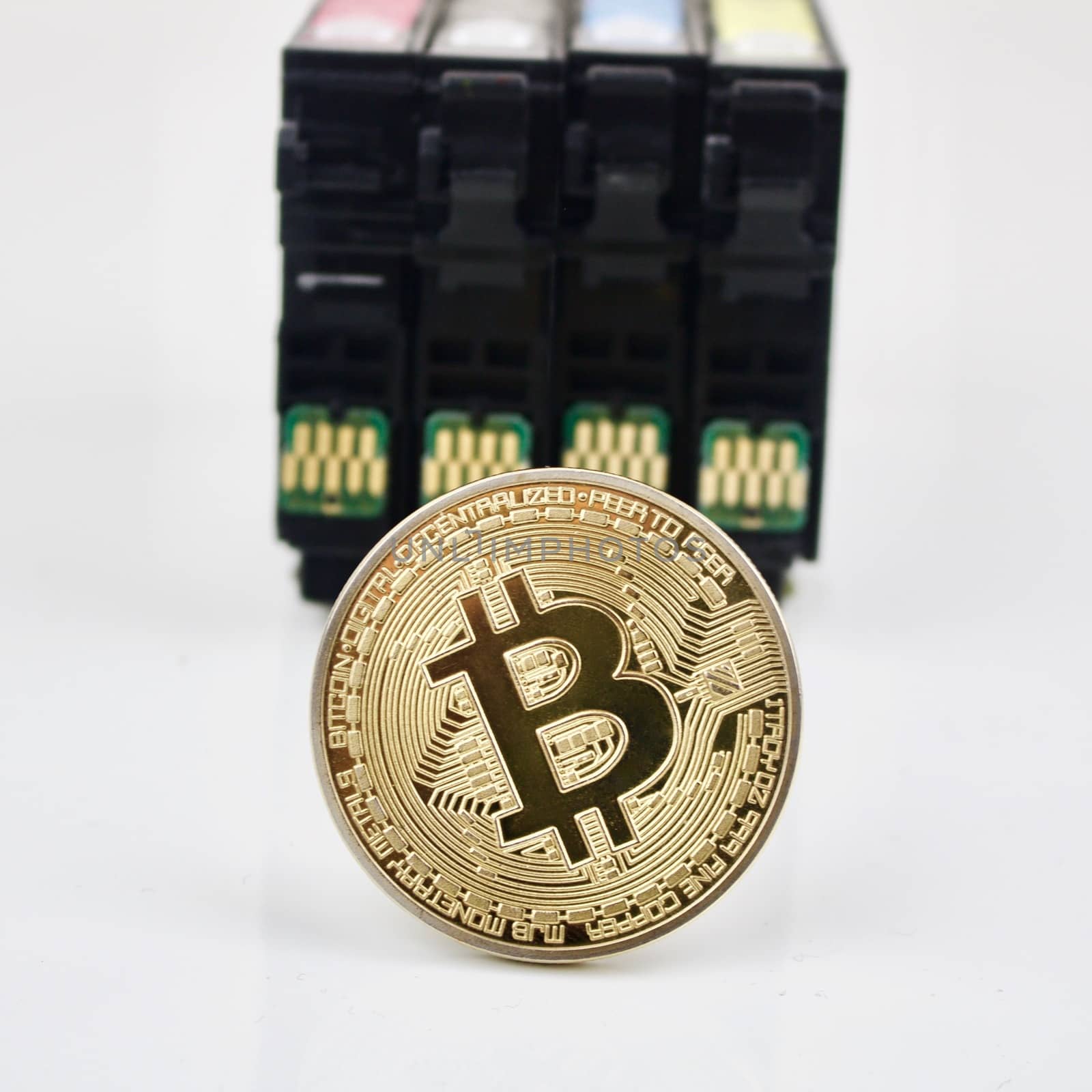 Bitcoin cryptocurrency gold coin and print cardridges