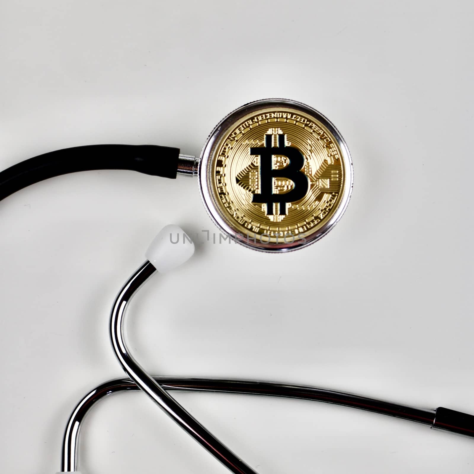 Cryptocurrency physical gold bitcoin coin in medical concept