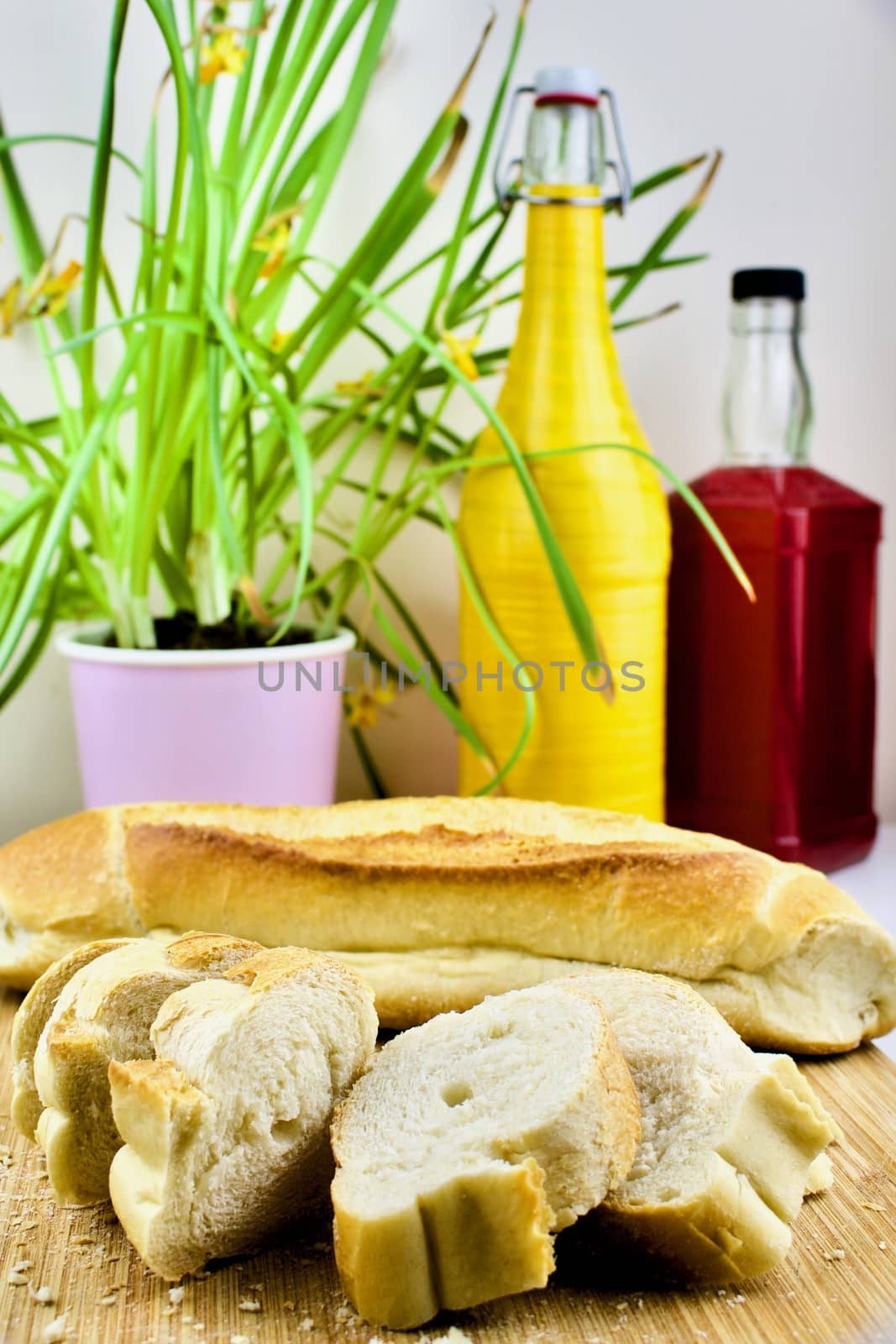 Colorful composition with bread and bottles