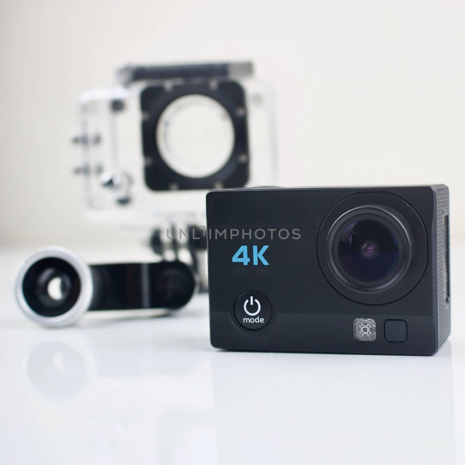 Black small sport camera 4K with equipment.