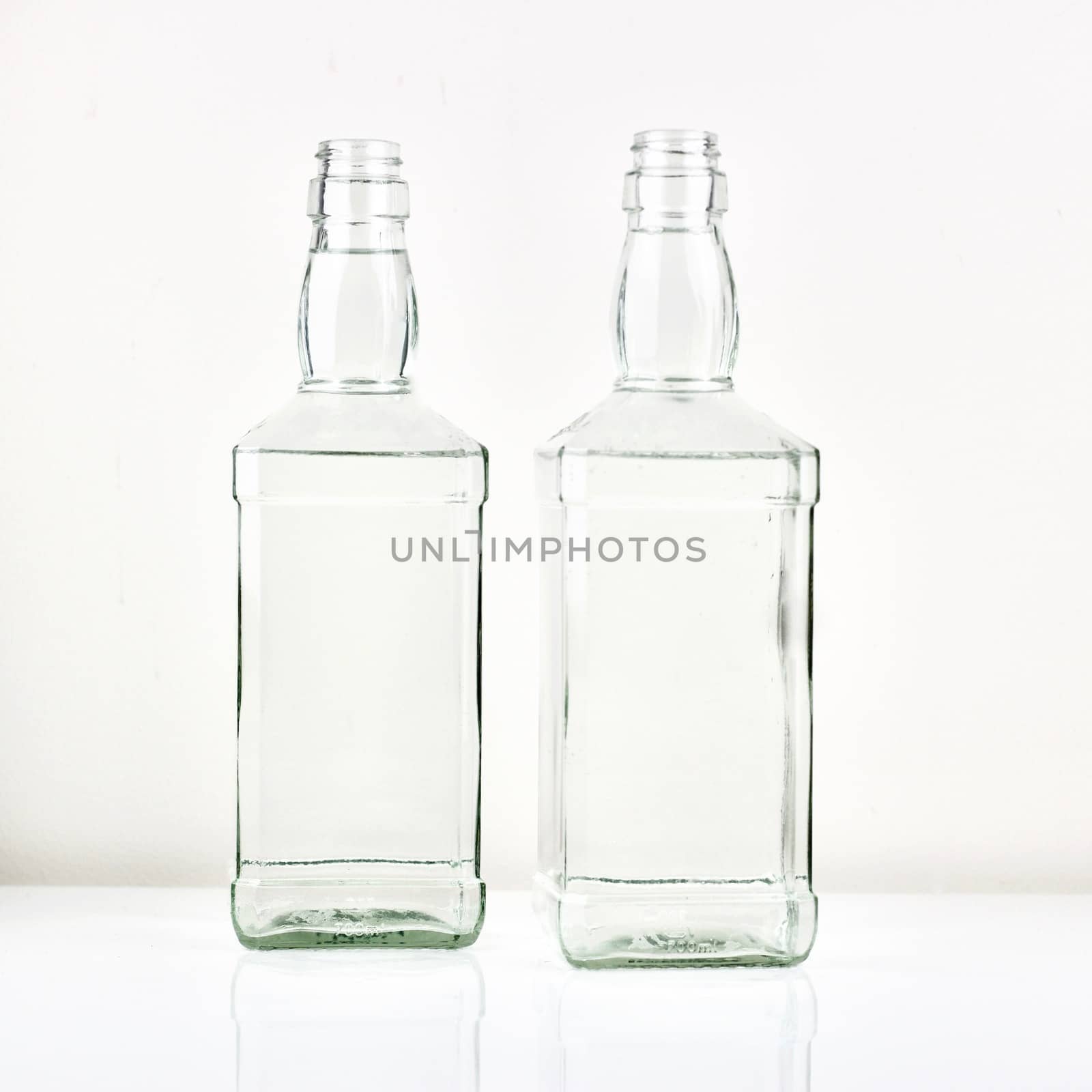 Two transparent bottles on the table