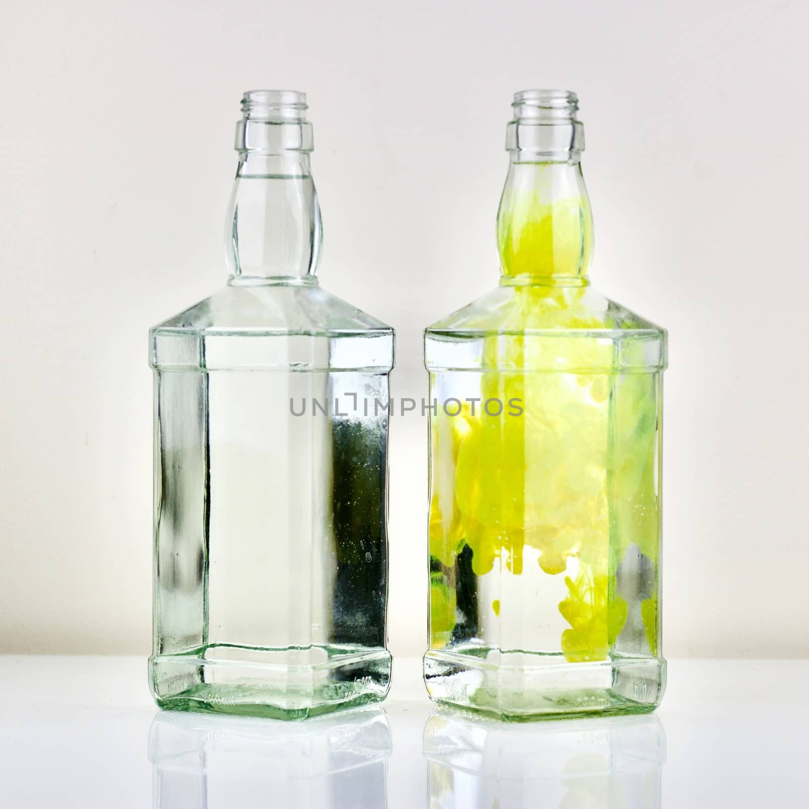 Two bottles on the table and yellow colour effect