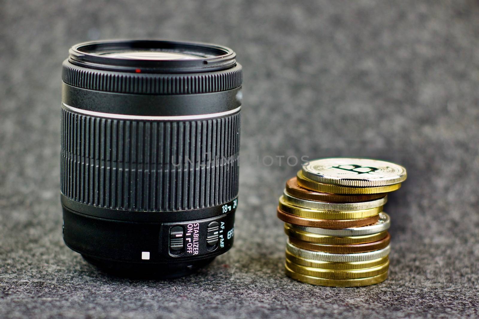 Cryptocurrency gold money and dslr camera lens