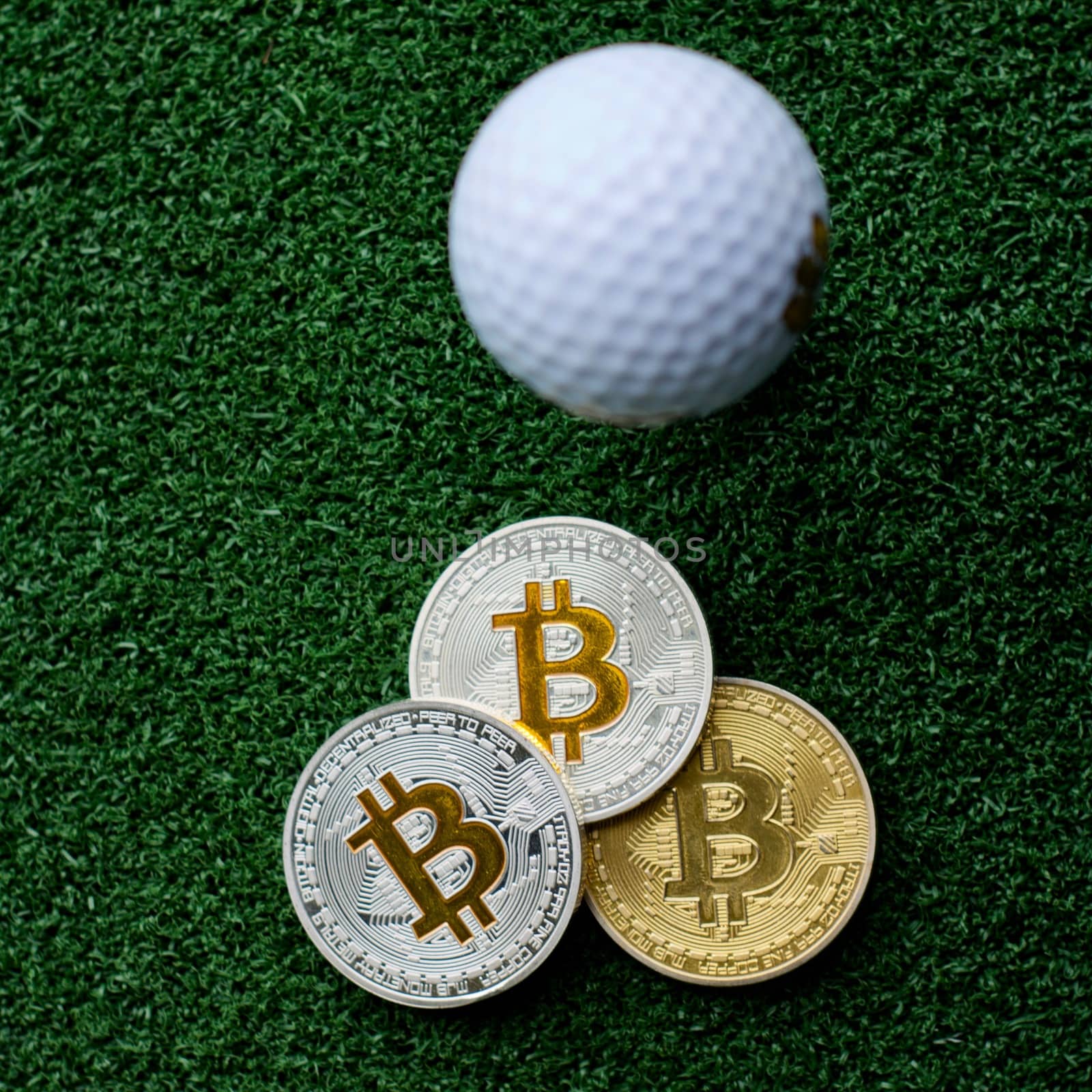 Digital currency physical bitcoin coins in golf club