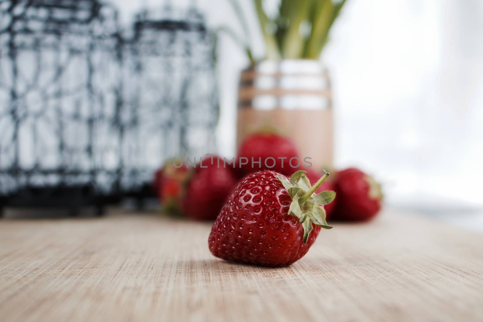 Big red fresh strawberry on the wooden board. Kitchen concept.