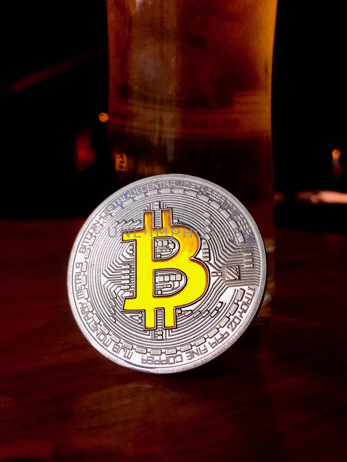 Cryptocurrency physical silver bitcoin coin with yellow sign