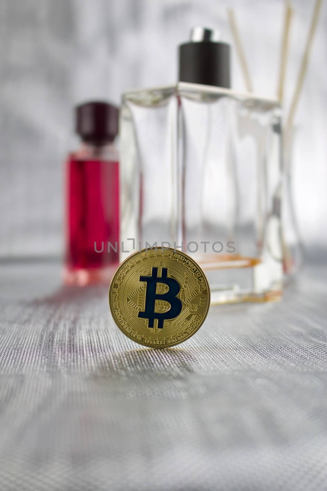 Cryptocurrency physical gold bitcoin coin in perfume spa