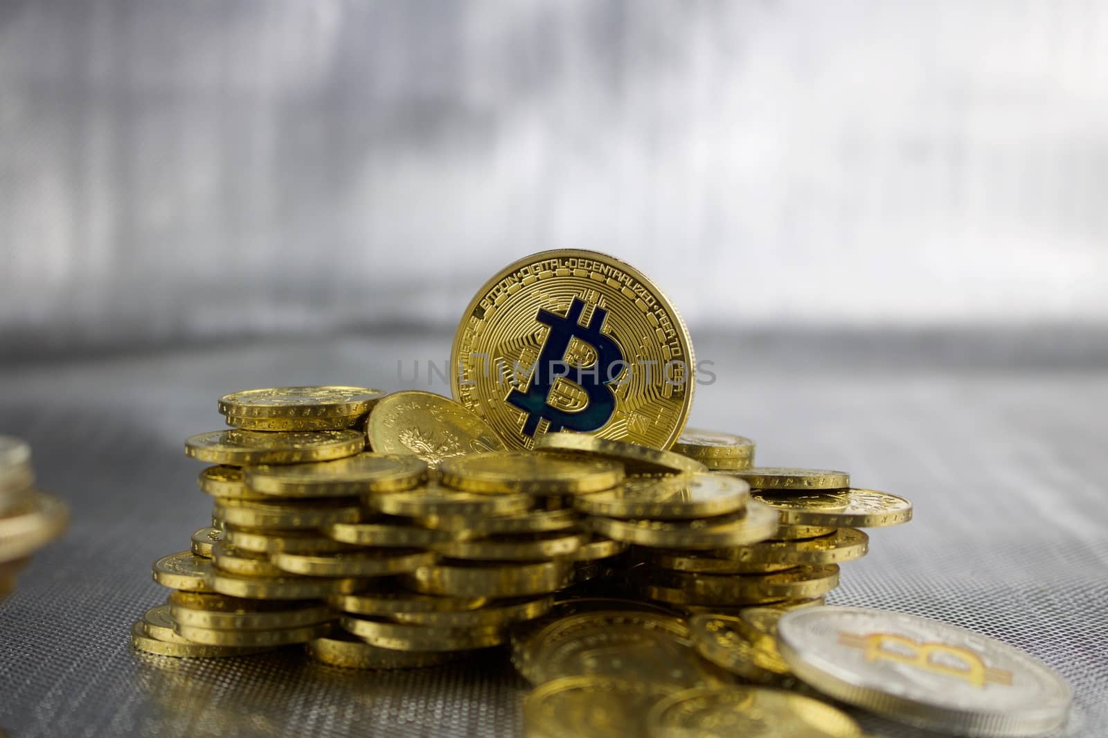 Cryptocurrency physical gold bitcoin coin near gold money.
