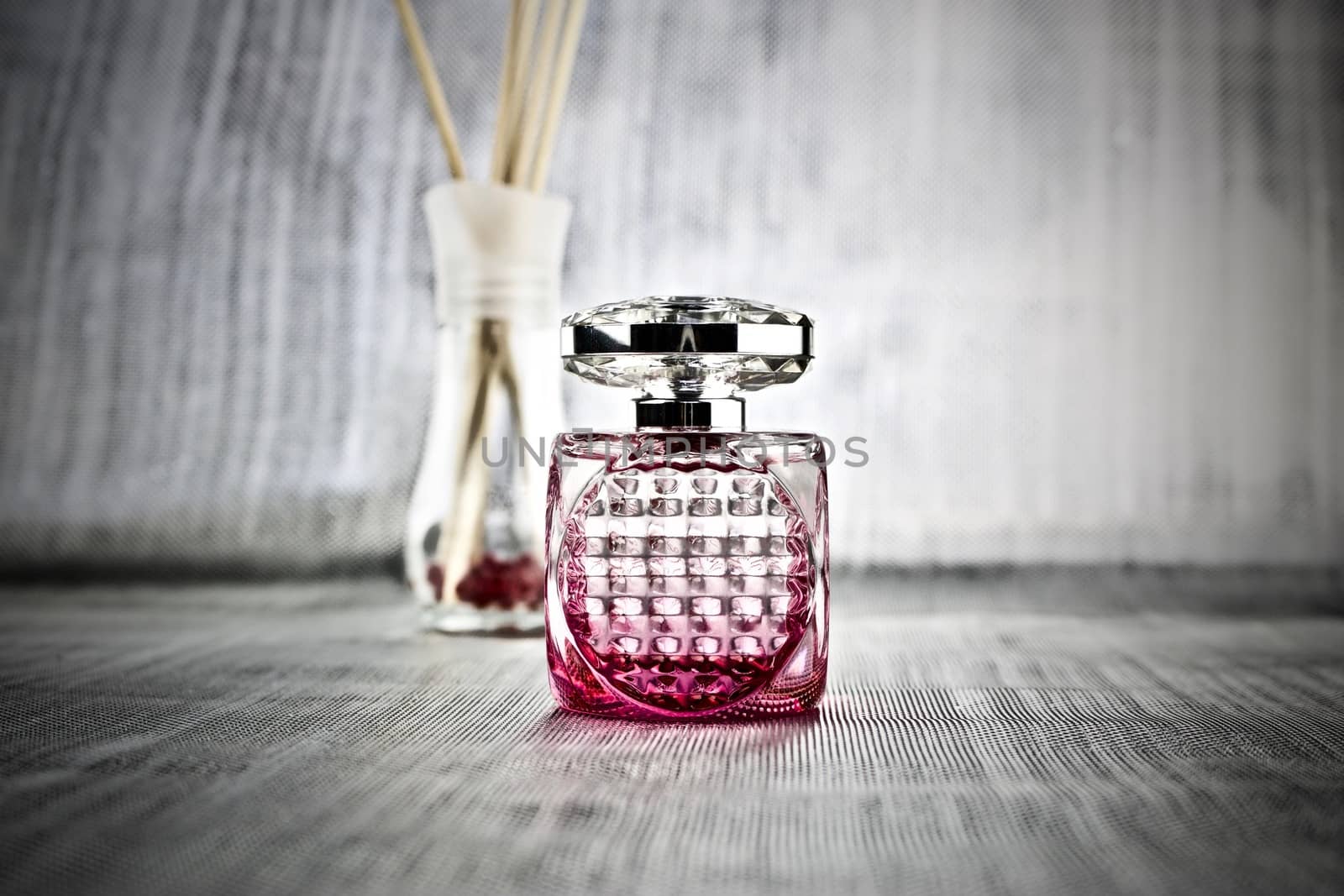 Luxury fragrance in pink square bottle