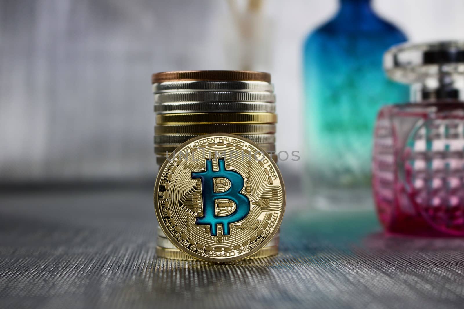 Cryptocurrency gold bitcoin coin with a blue sign