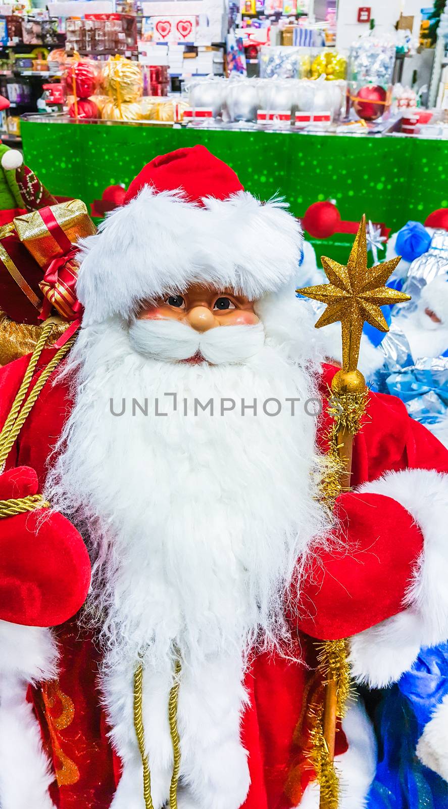 Santa Claus toy in supermarket. Christmas eve