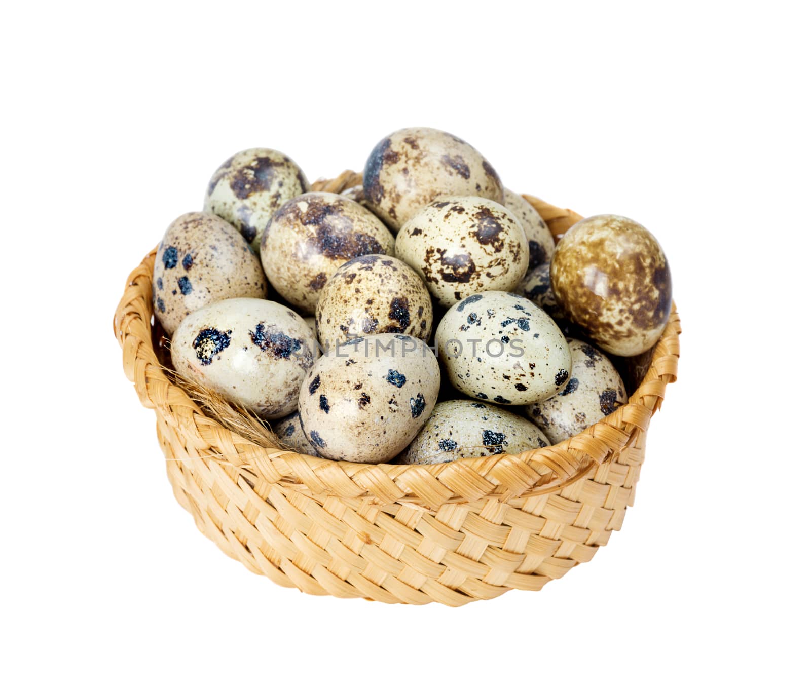 Basket full of quail eggs isolated on white background