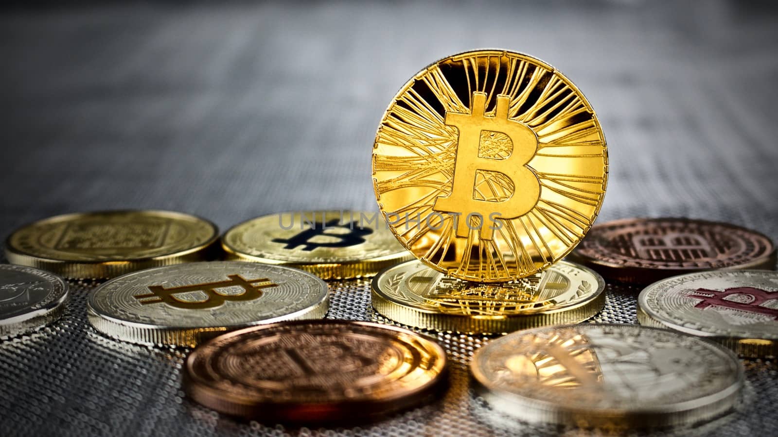 Cryptocurrency physical gold bitcoin coin on bitcoins. Money concept.