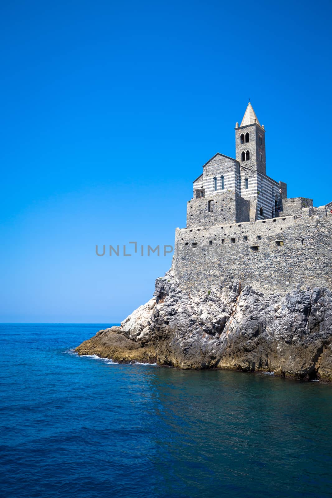 Bright colors in this panorama from the sea of San Pietro Church in Porto Venere, Italy