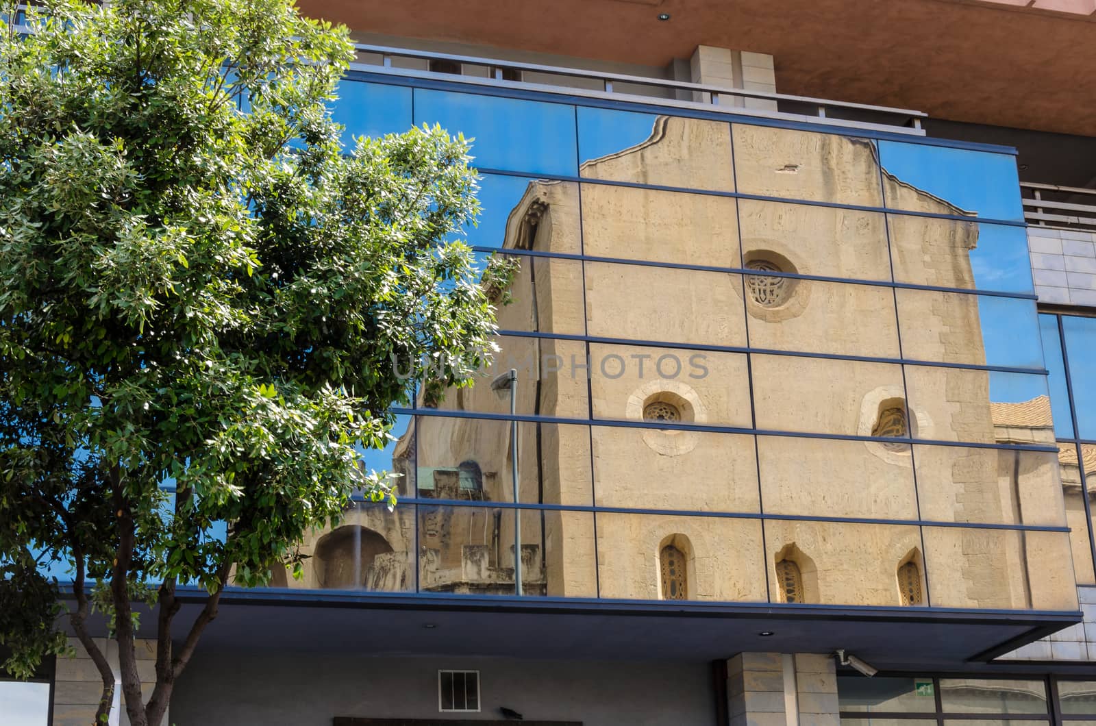 Italy: The Old church and modern building.