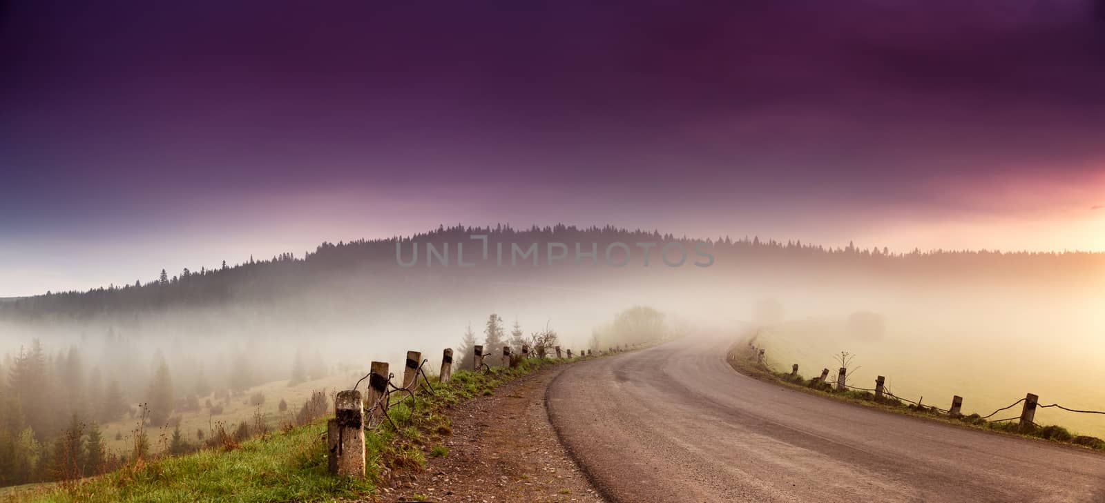 Road in mountain range panorama. Beautiful spring foggy morning  by weise_maxim
