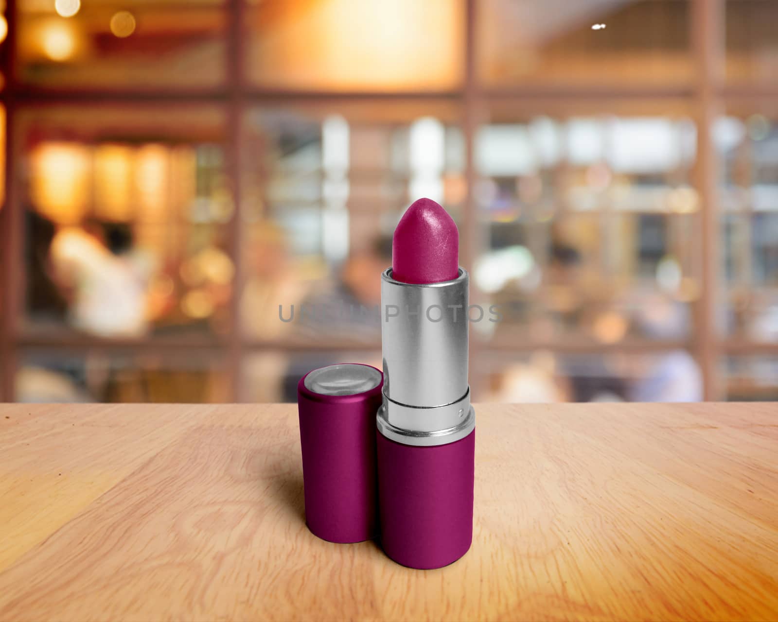 lipstick closeup on wooden table