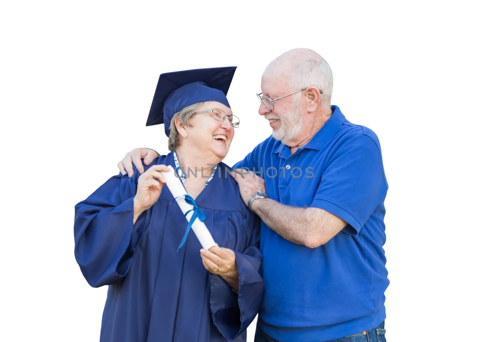 Senior Adult Woman Graduate in Cap and Gown Being Congratulated By Husband Isolated on White.