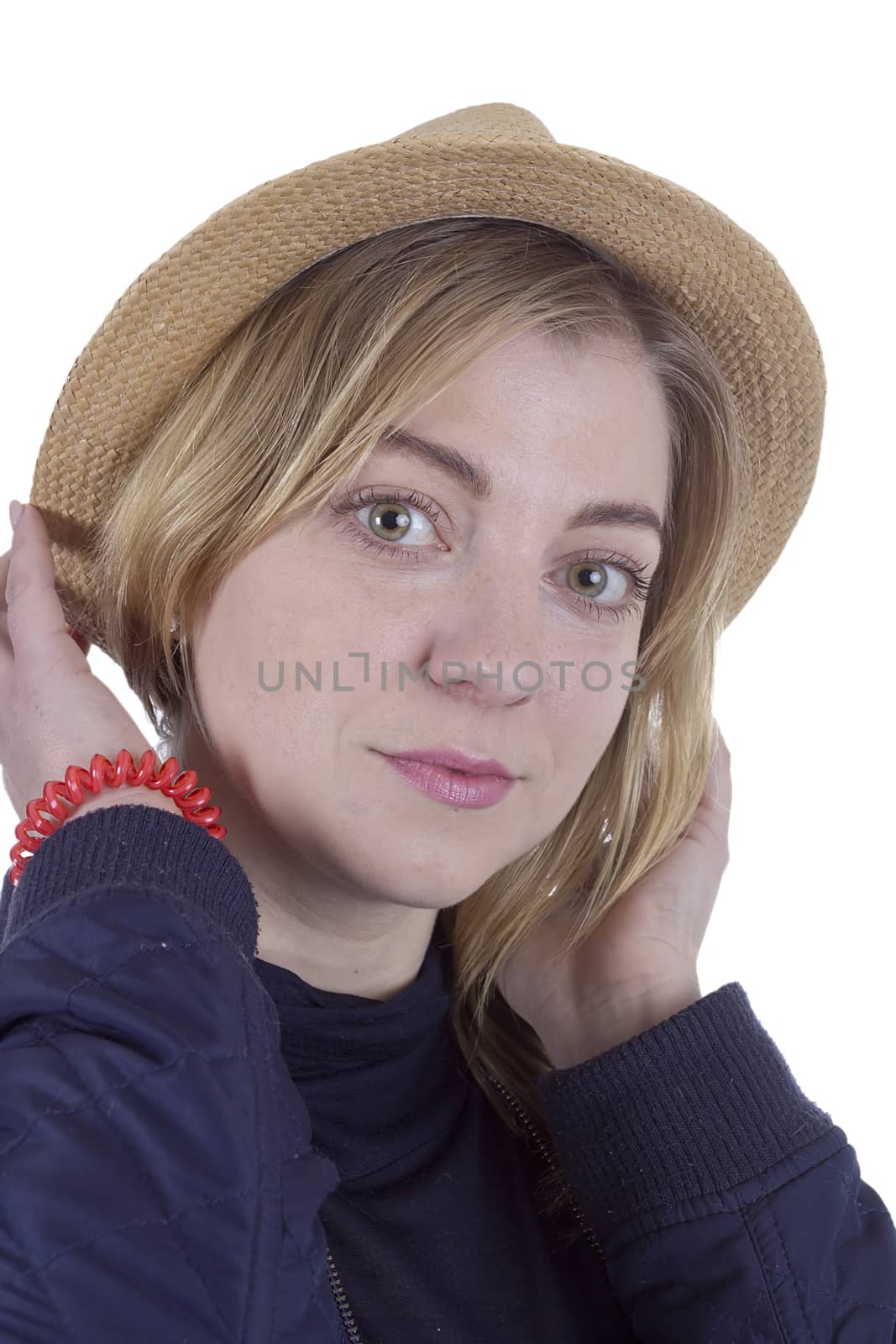 Portrait of a young blonde woman in a straw hat