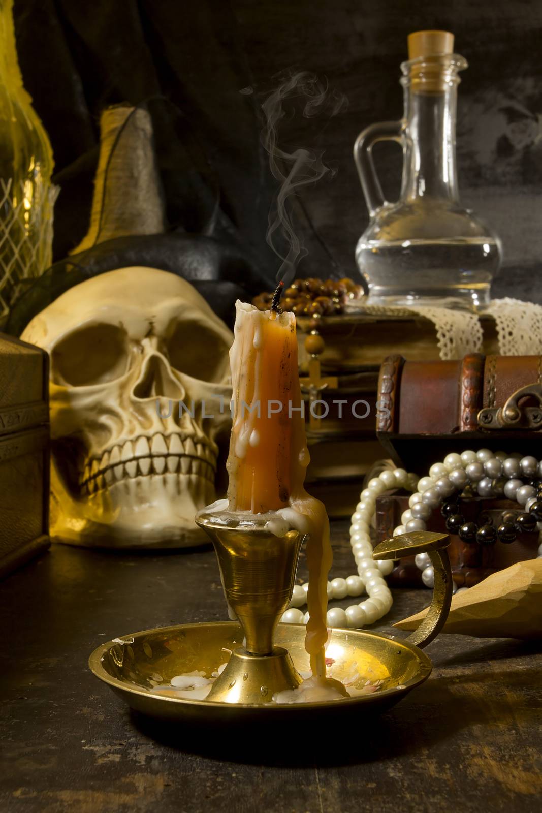 Gothic still life with a skull and a candle