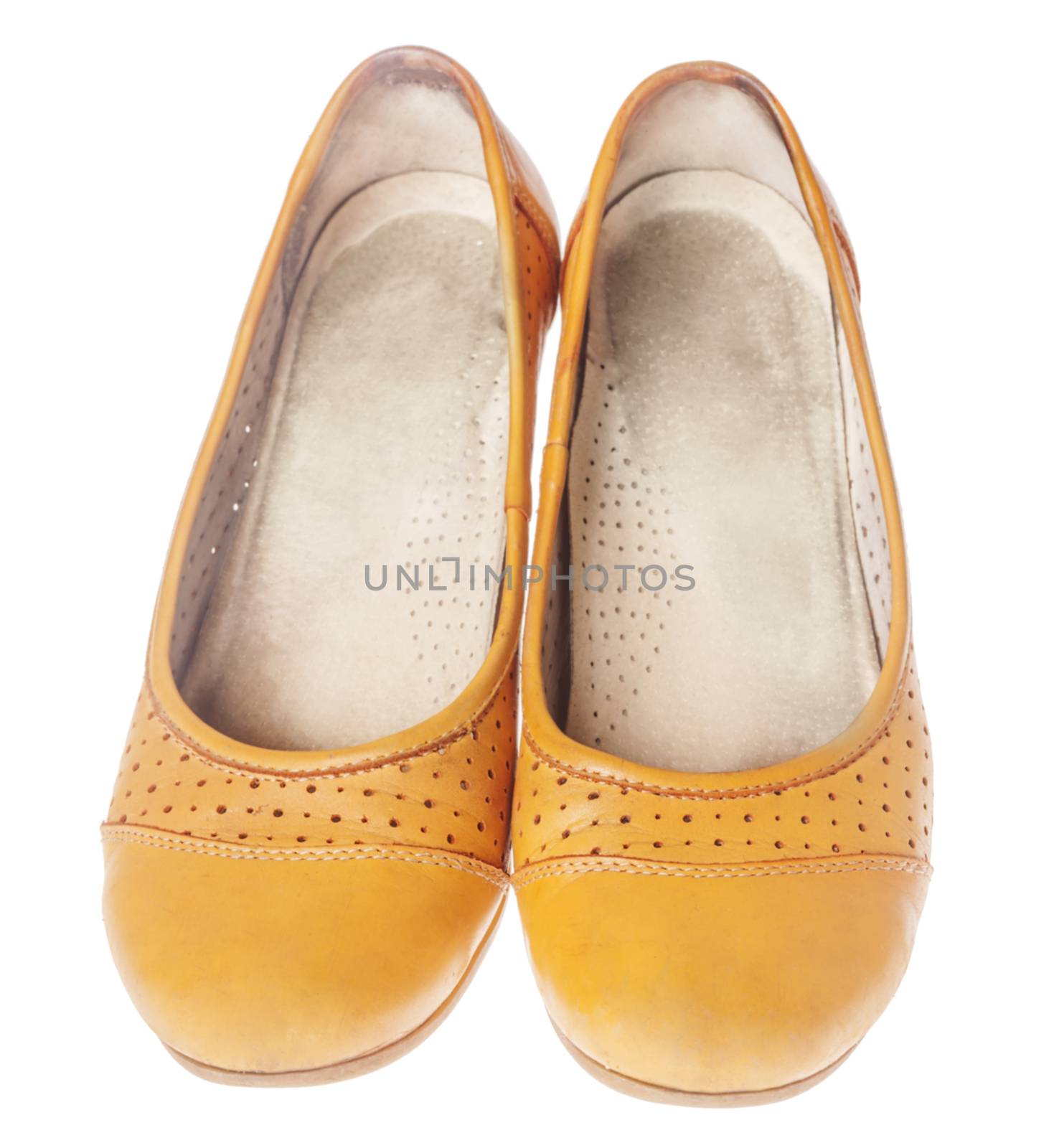 Comfortable orange leather flat shoes isolated on white