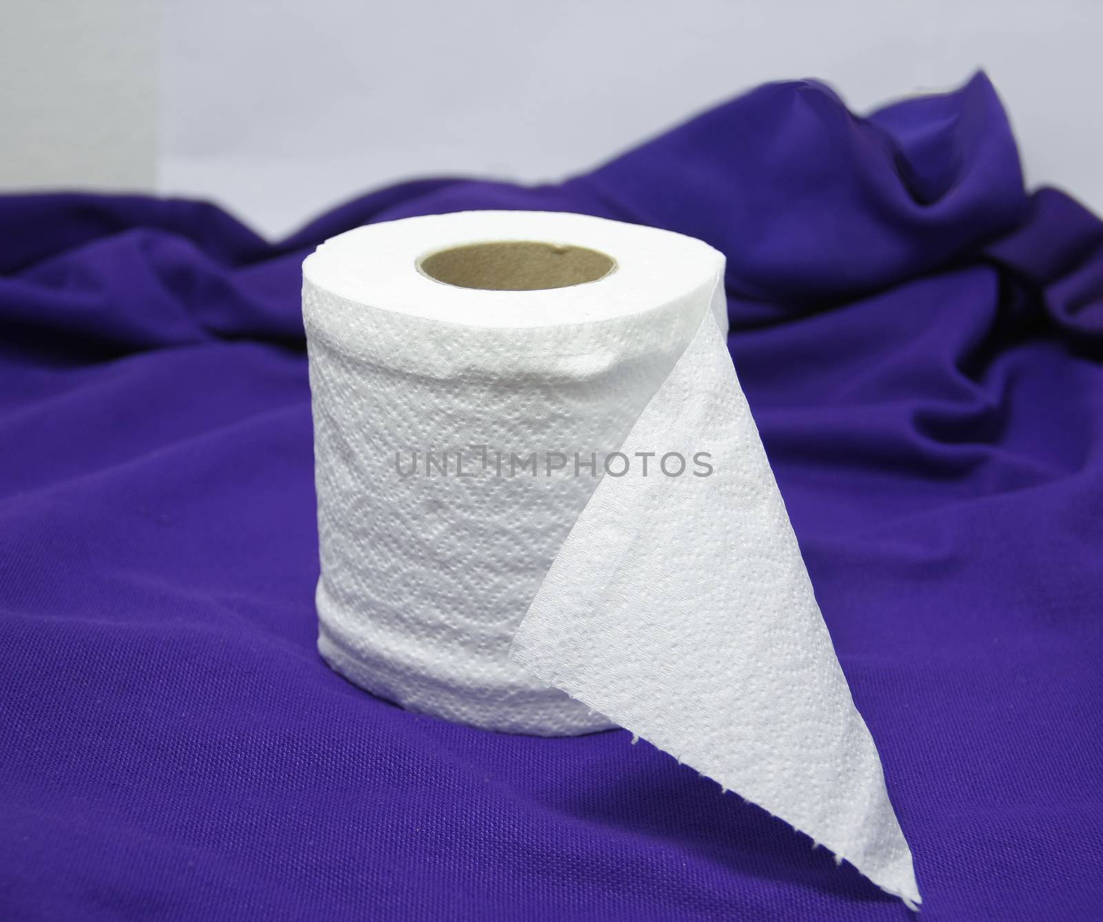 roll fresh tissue on purple cloth for convenience
