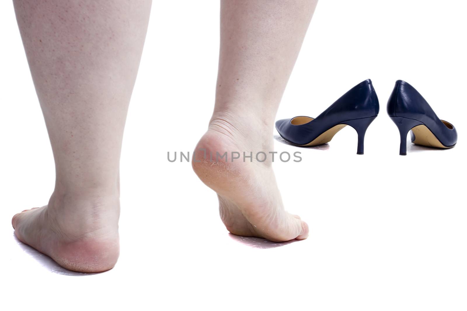 Female legs and shoes. Isolated on white background